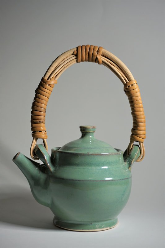 batesjeremie-green-teapot-2-porcelain-with-cane-handle-9-x-6-5-2019.jpg