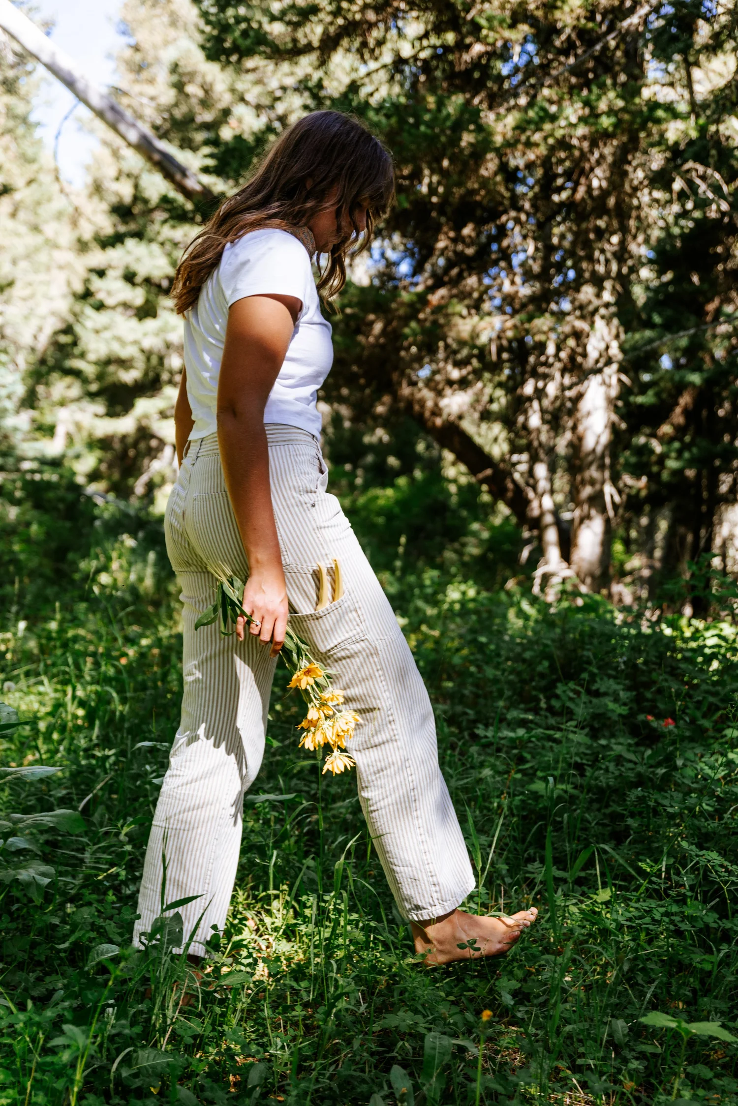 Lauren walking through a wildflower meadow