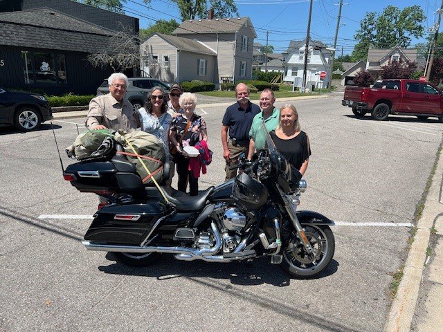 Posing by the 'ride' in Plymouth, Michigan with patients & caregivers.