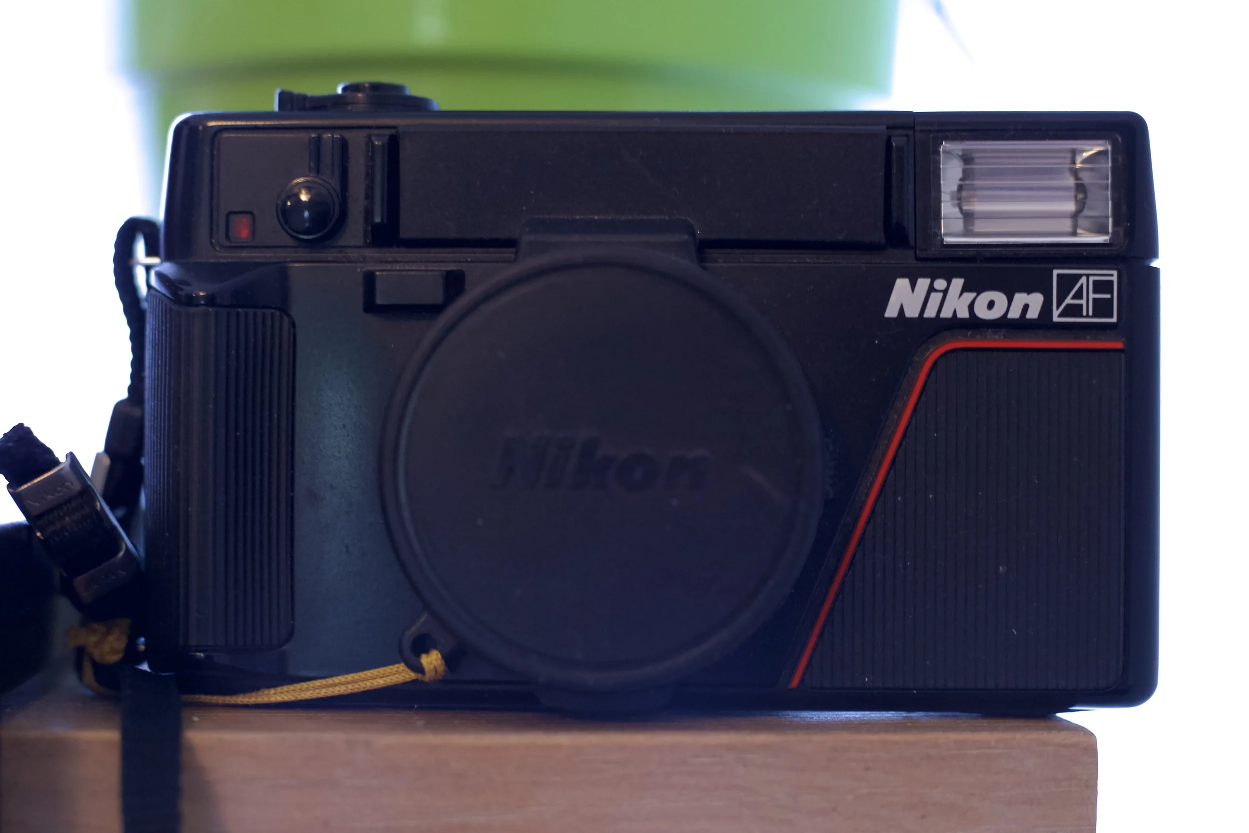 Vintage Nikon AF camera with lens cap