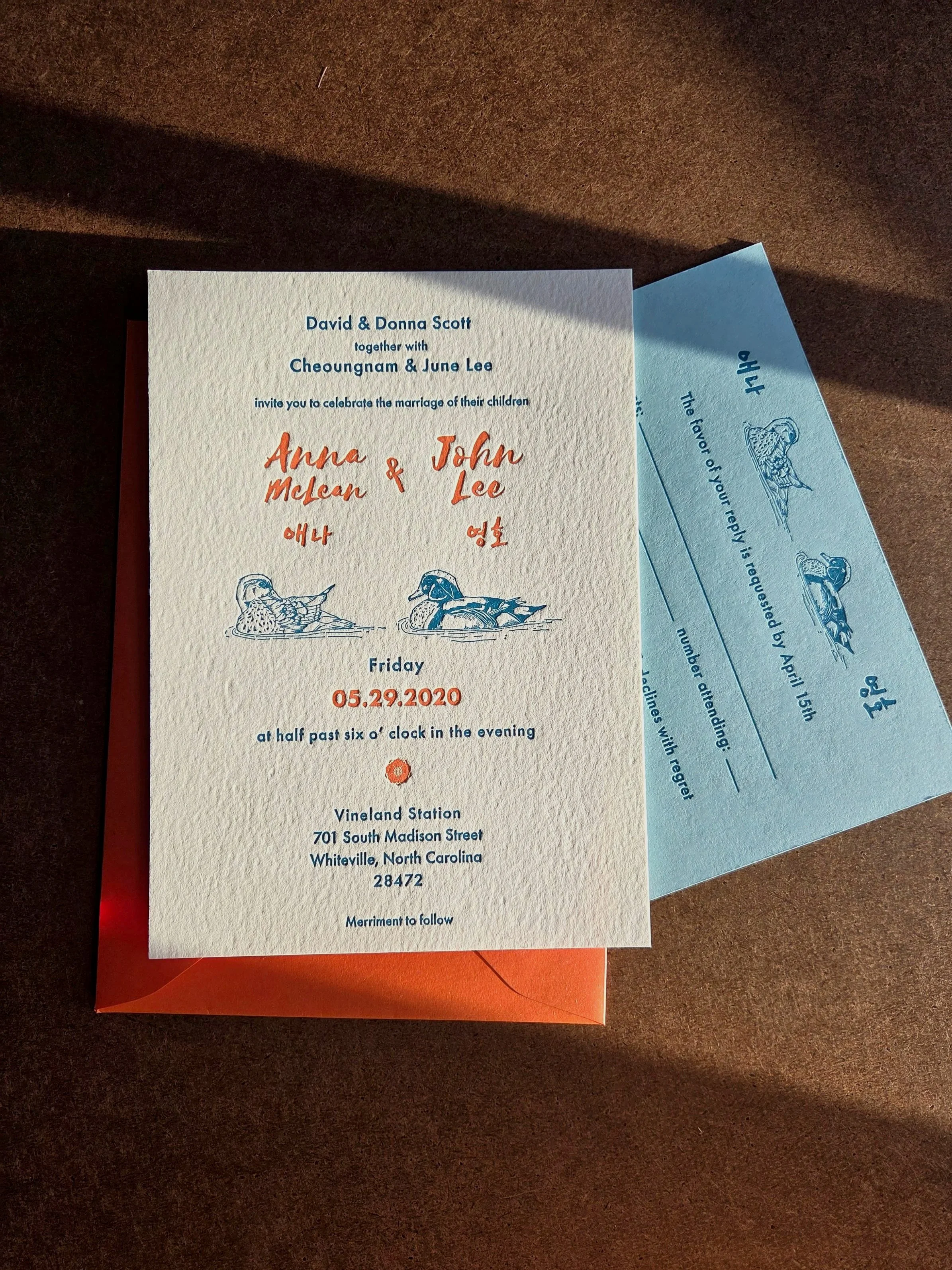 Wedding invitation suite with custom illustration of ducks and Korean language.