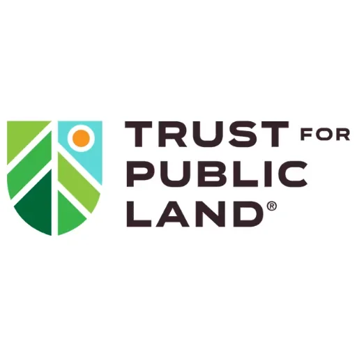 Logo of Trust for Public Land featuring a stylized shield with green, blue, and orange elements and the organization's name in black text.