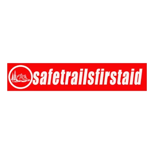 Red rectangular logo with white text 'safetrailsfirstaid' and a white icon of a mountain and trail within a circle on the left side.