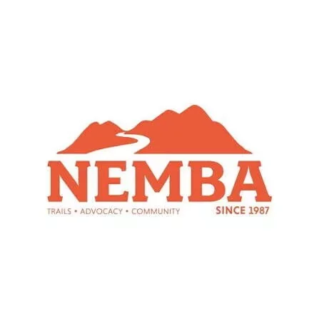 Nemba logo with mountain range graphic, text 'Nemba', and tagline 'Trails, Advocacy, Community' with 'Since 1987'.