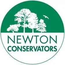 Logo of Newton Conservators featuring a tree and a bird in a green circular design
