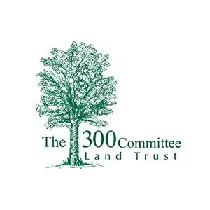 Logo of The 300 Committee Land Trust featuring a large green tree and the organization name.