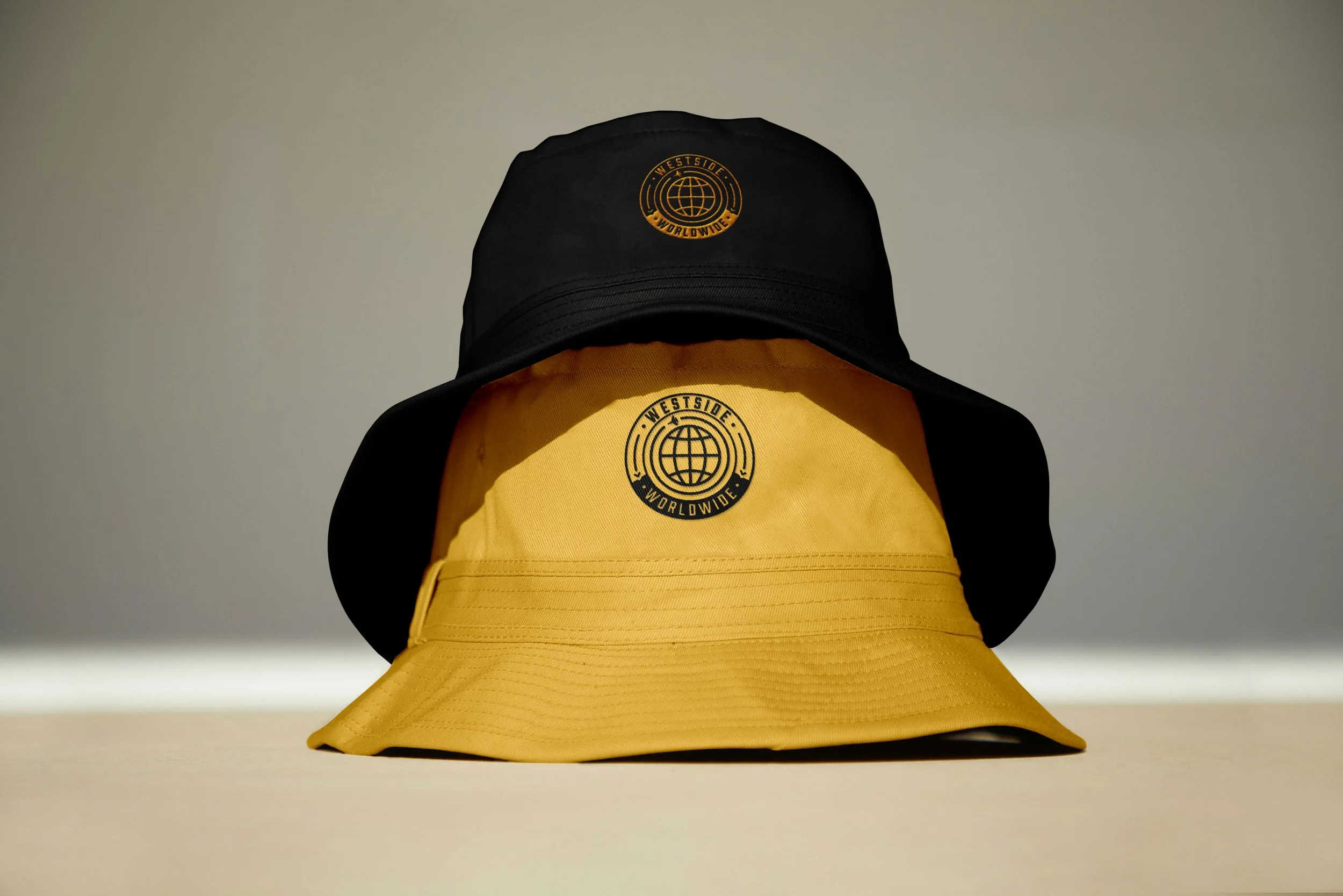 WW-WestsideWorldwide-Badge-JetsFly-BucketHats-YellowBlack-2024.jpg