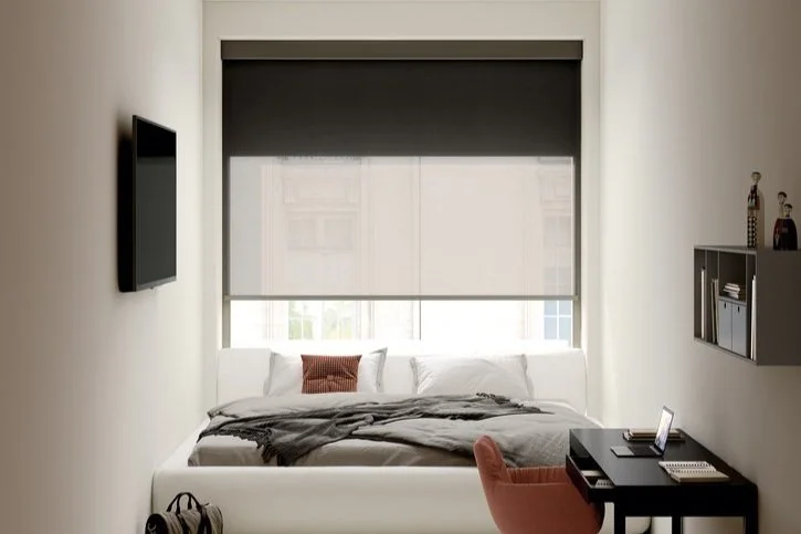 Small and cozy bedroom with two fabric colours window blind from b box duo range.