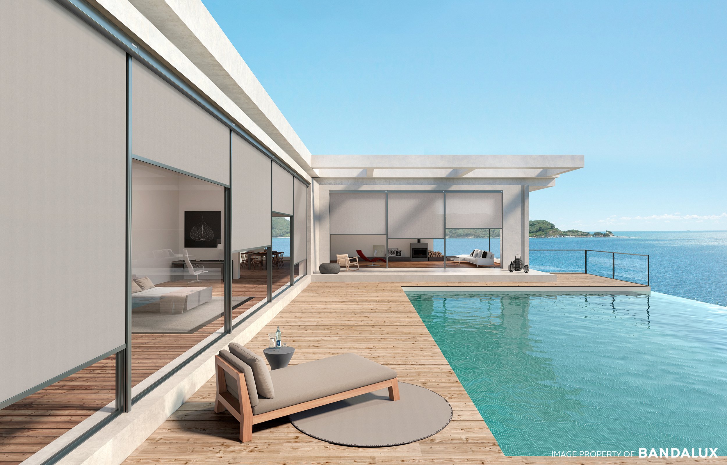 Modern beach house with grey roller blinds from b box system installed outside.