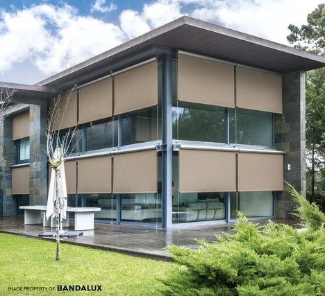 Few beige bandalux blinds with motor operation installed externally.