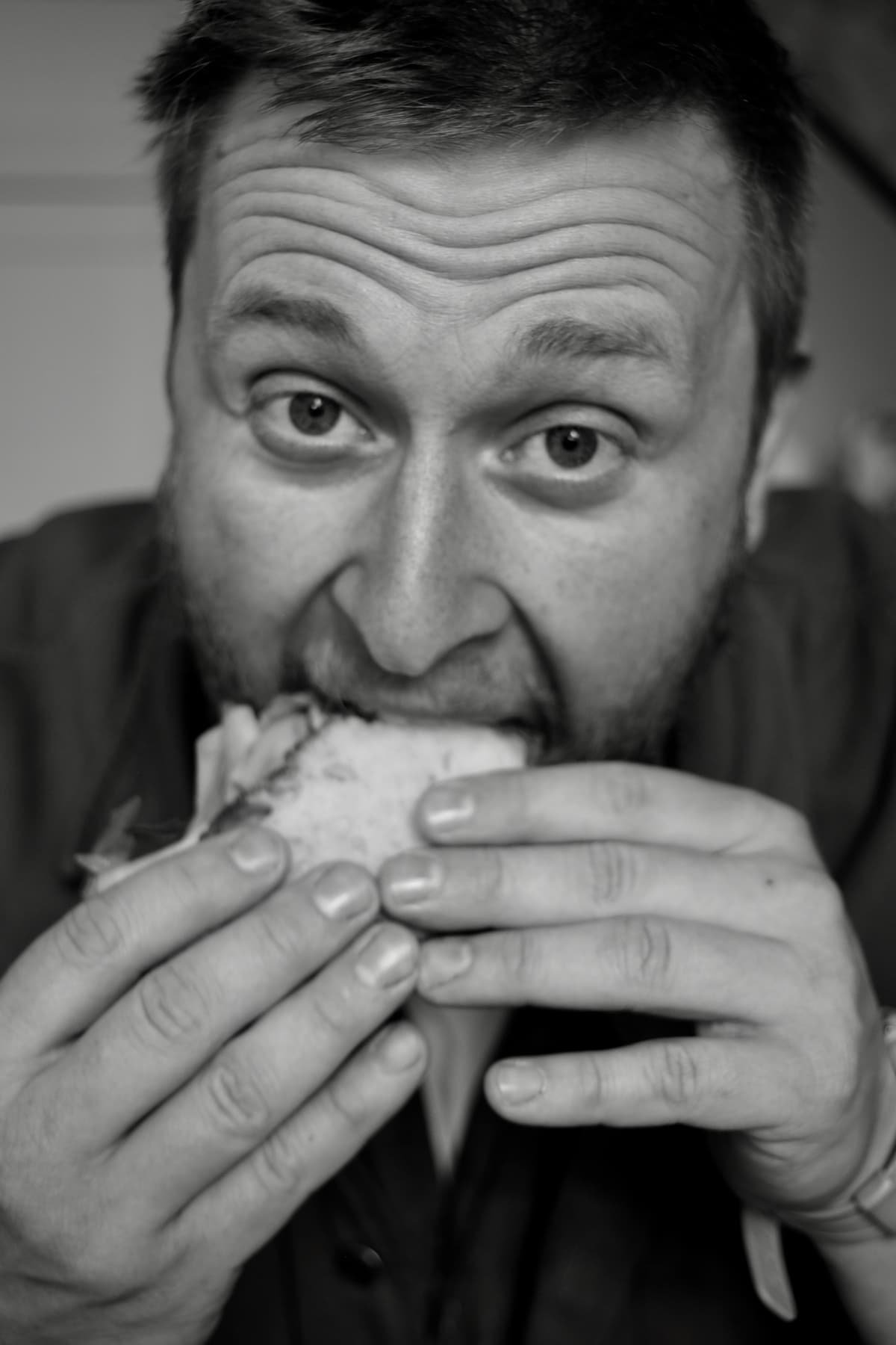 Tucking in to a sandwich