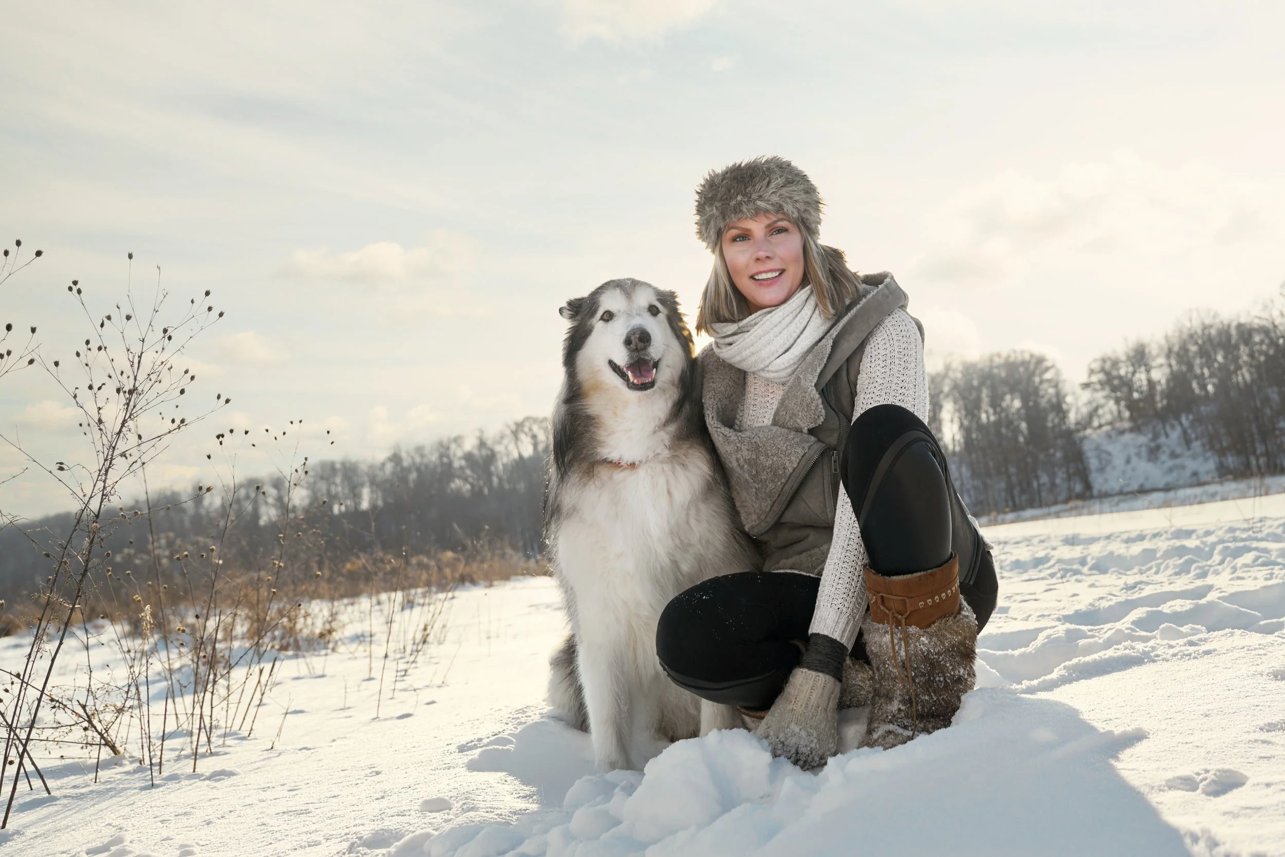 Photograph of a woman and her dog.
