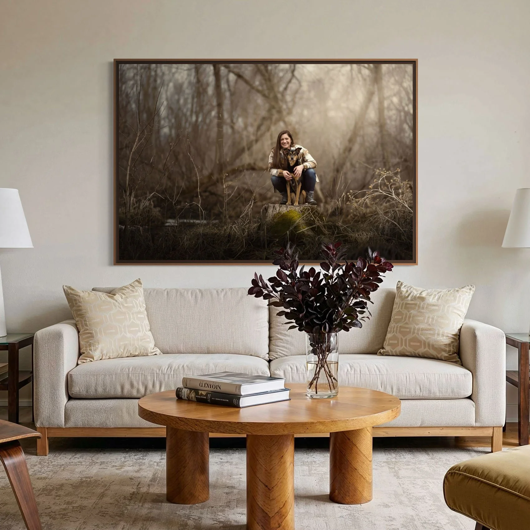 Framed photograph of a woman and her dog on a loving room wall.