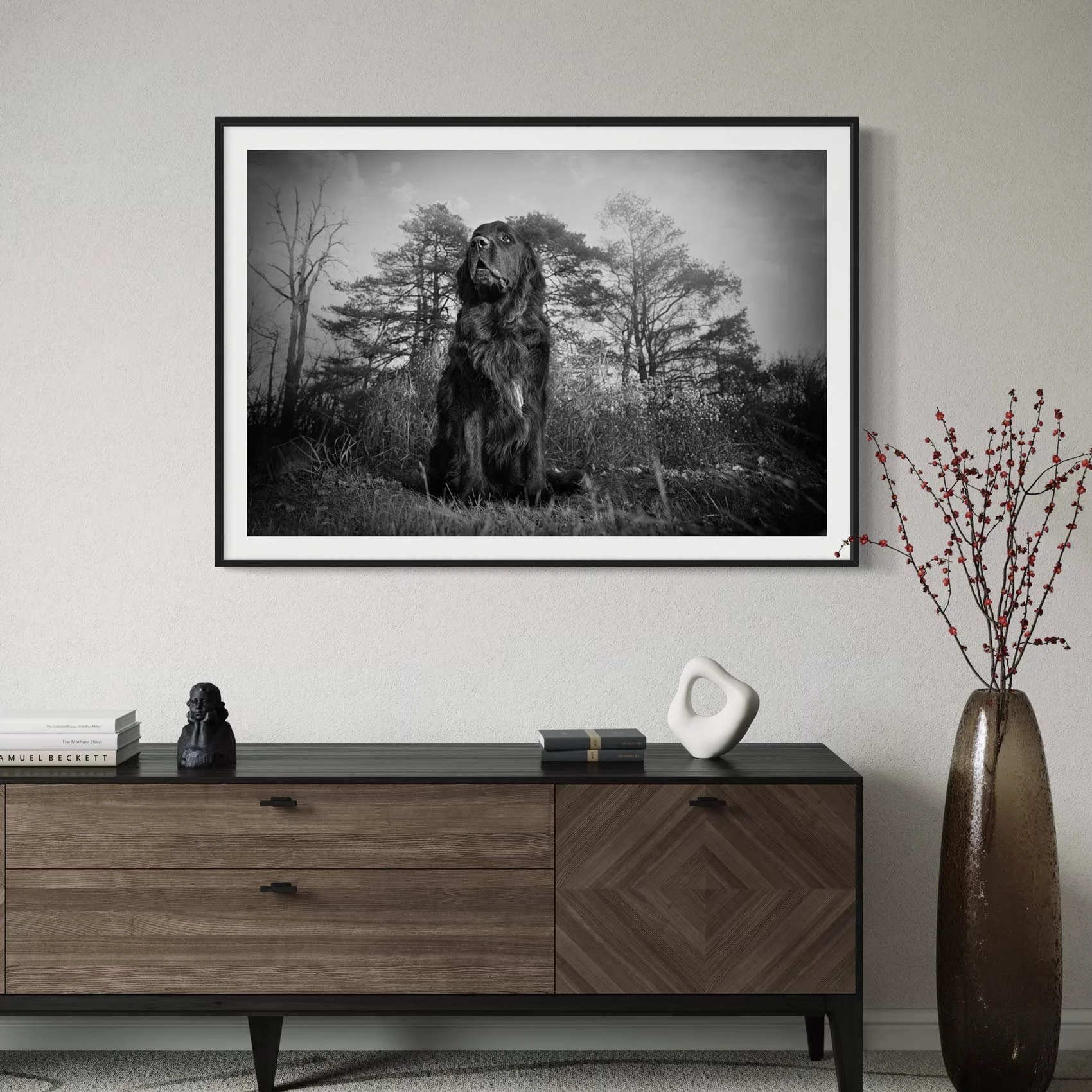 Black & white framed portrait of a dog in a living room.
