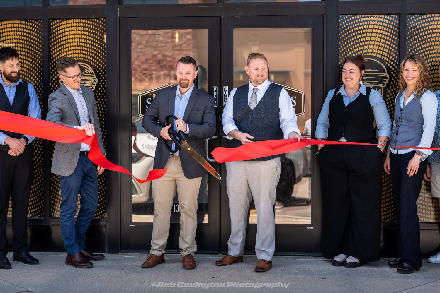 Snipps ribbon cutting event photography by Rob Covington