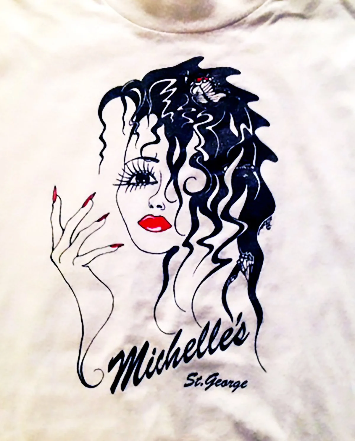 Pen and ink drawing of a woman with butterfly wings in her hair, prominently featuring her hand with painted nails. Created as a logo for a nail salon, for use on signage and t-shirts.