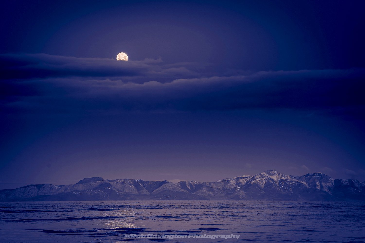 Full moon setting at the Great Salt Lake, by Rob Covington.