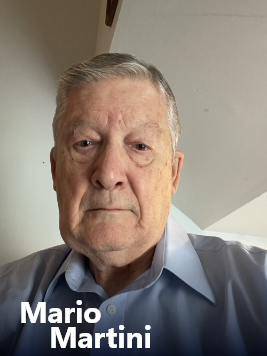 Close-up of an older man with gray hair wearing a light blue collared shirt, looking serious, with text 'Mario Martini' at the bottom left.