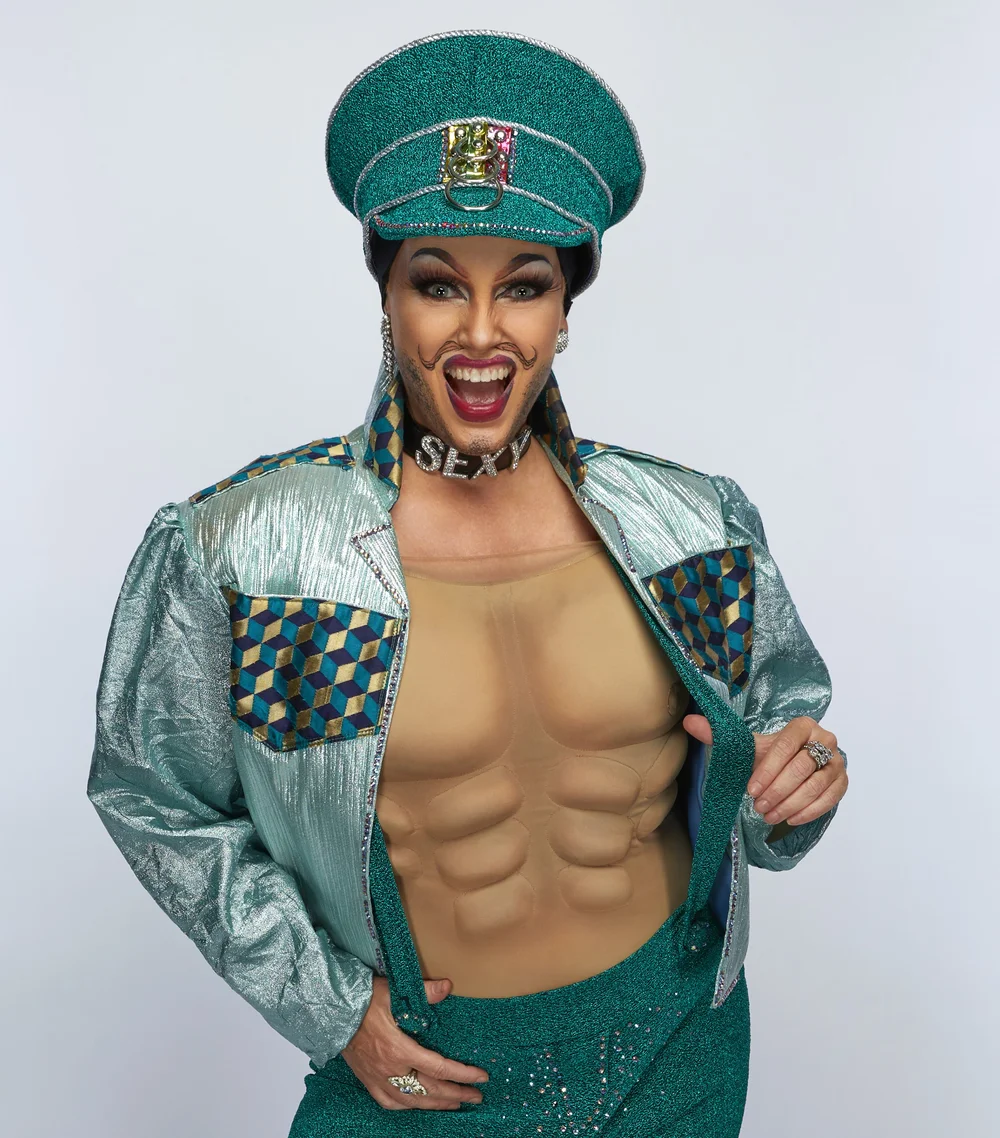 Sexy Galexy in a sparkling turquoise cap and metallic jacket