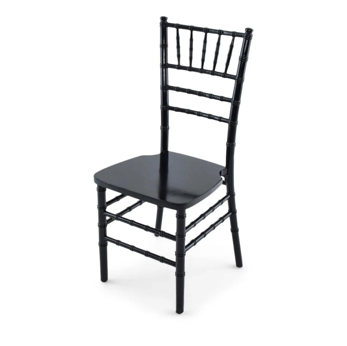 Black wooden chair with a embossed design on the backrest and legs, without a cushion, on a white background.