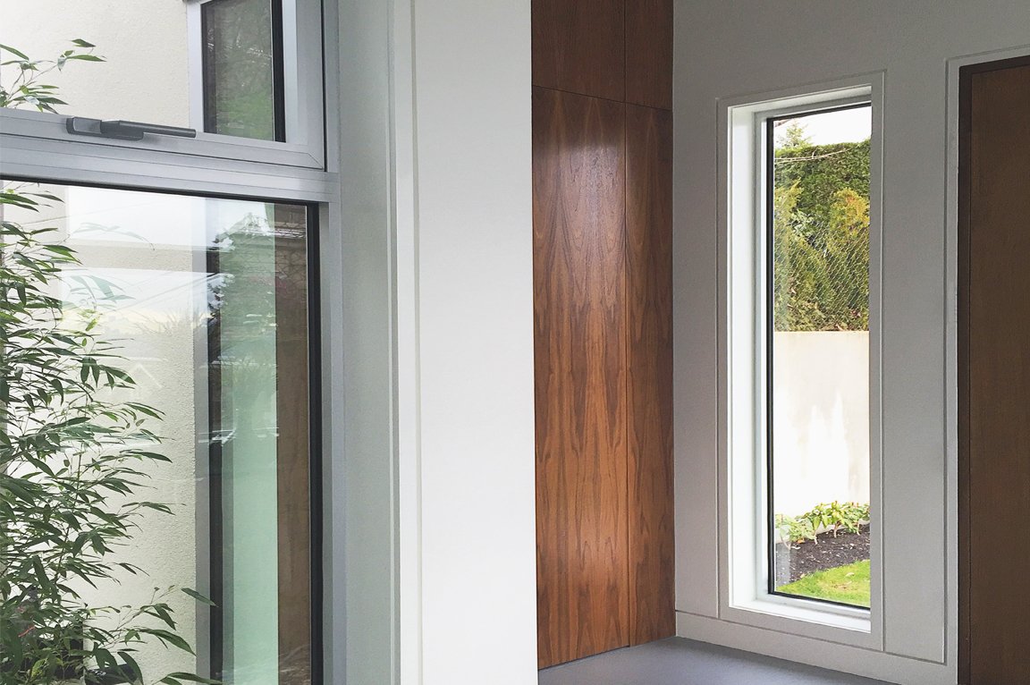 Modern interior with large windows and wood paneling