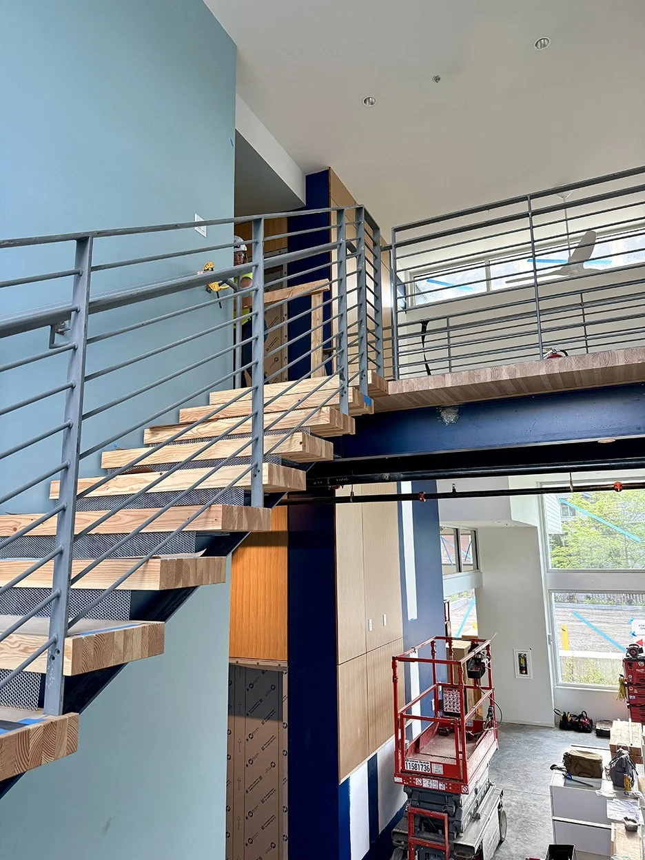 Interior of Helpline House featuring an open tread staircase.