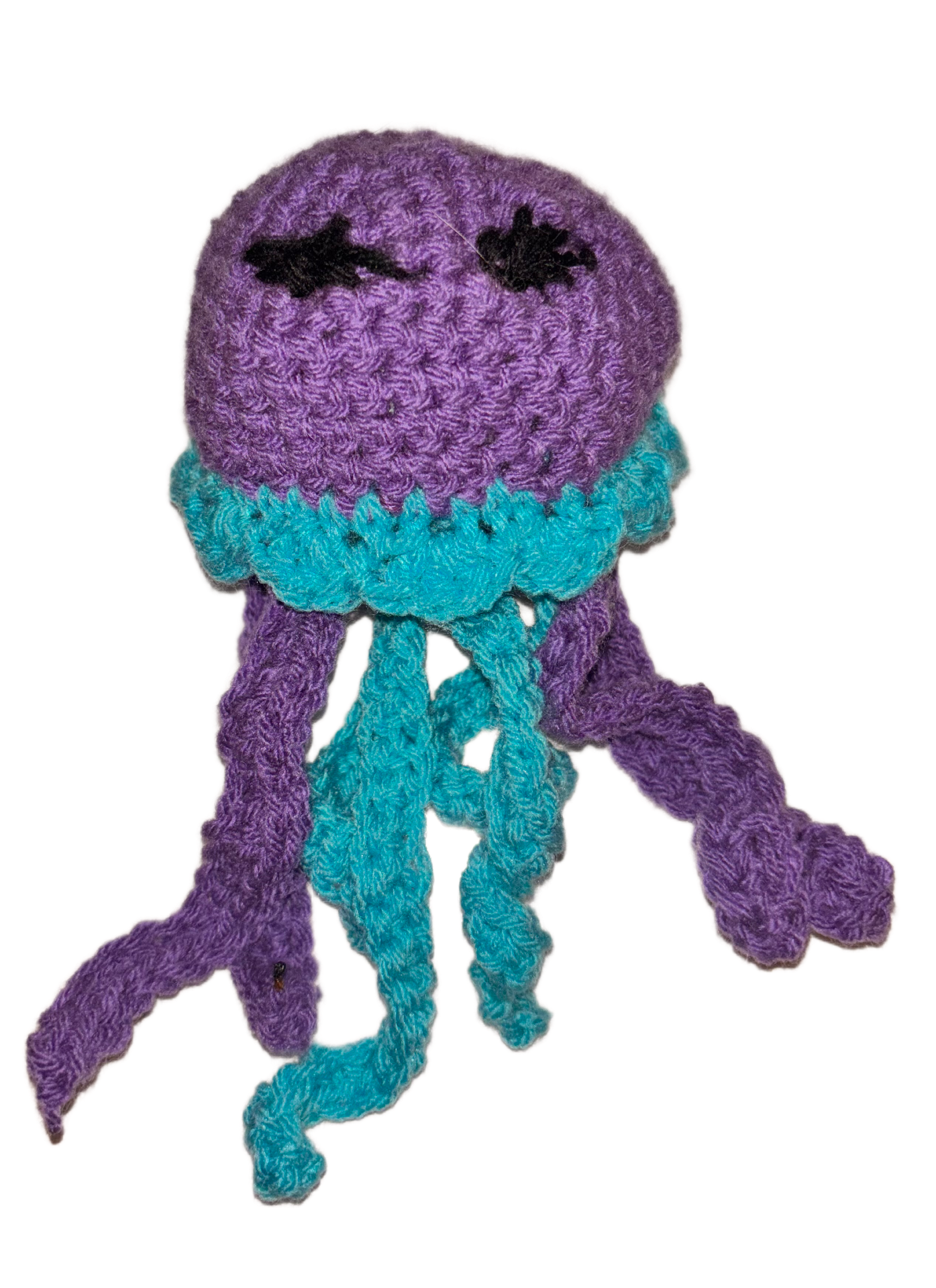 A crocheted purple octopus with black eyes and a teal ruffled collar, hanging gray tentacles.