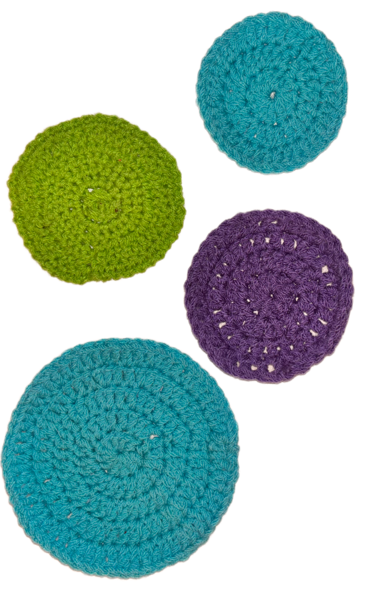 Four colorful crocheted circular coasters in blue, green, purple, and teal arranged on a white background.
