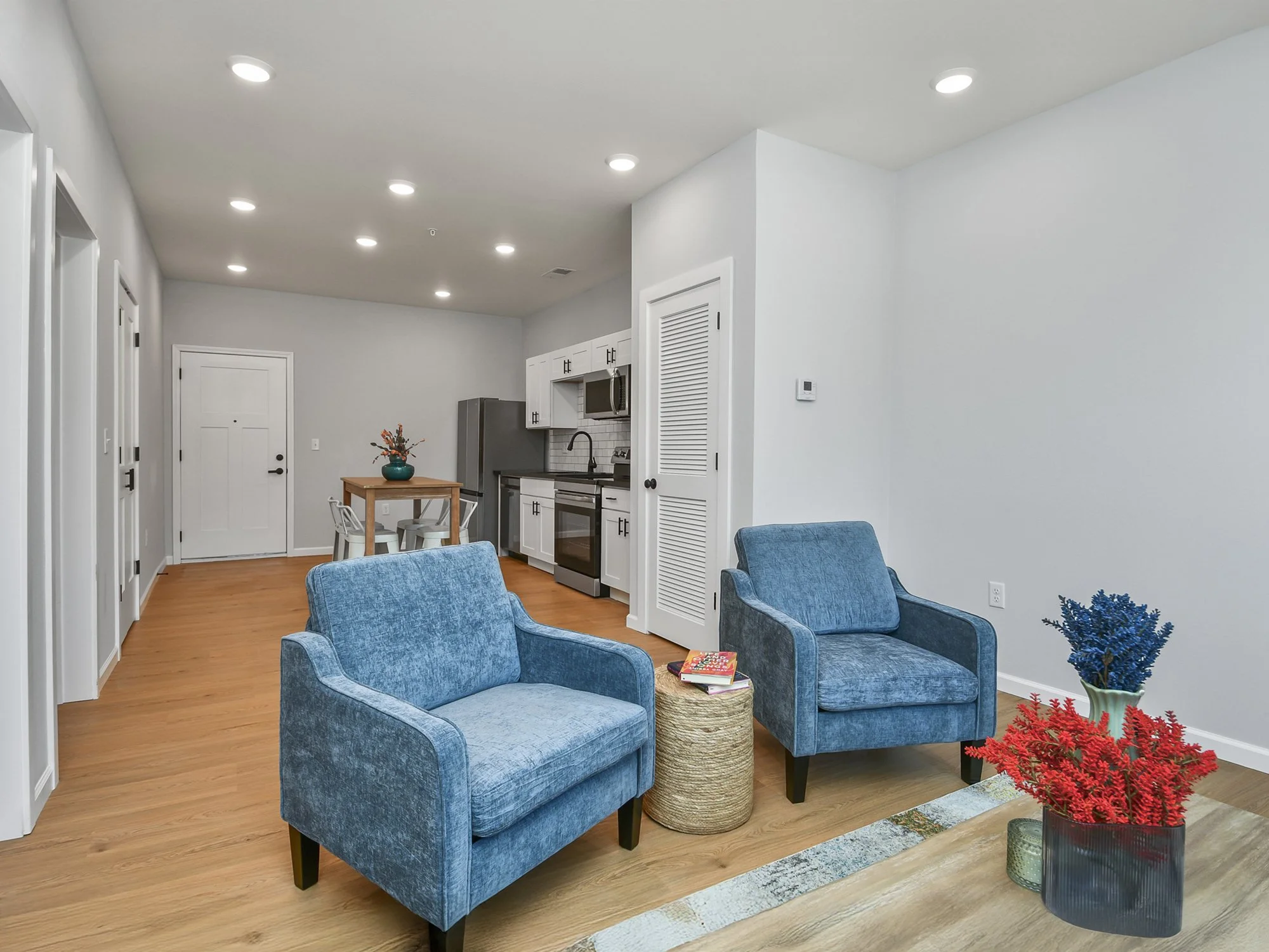 07-The-Knoll-1-Bed-living-arm-chairs-coffee-table.jpg