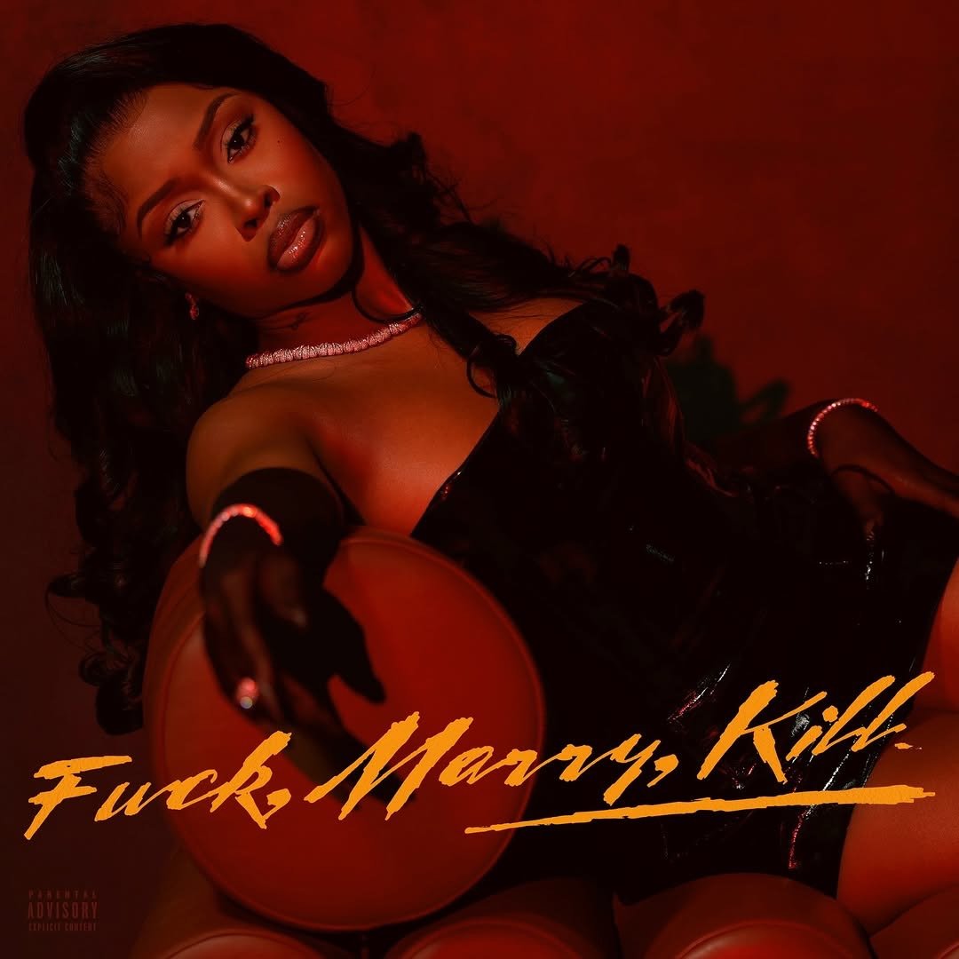 A woman with dark hair and makeup sitting among orange basketballs, wearing black gloves and a black outfit, with red lighting and the text 'F***k Marry Kill' in orange across the bottom.