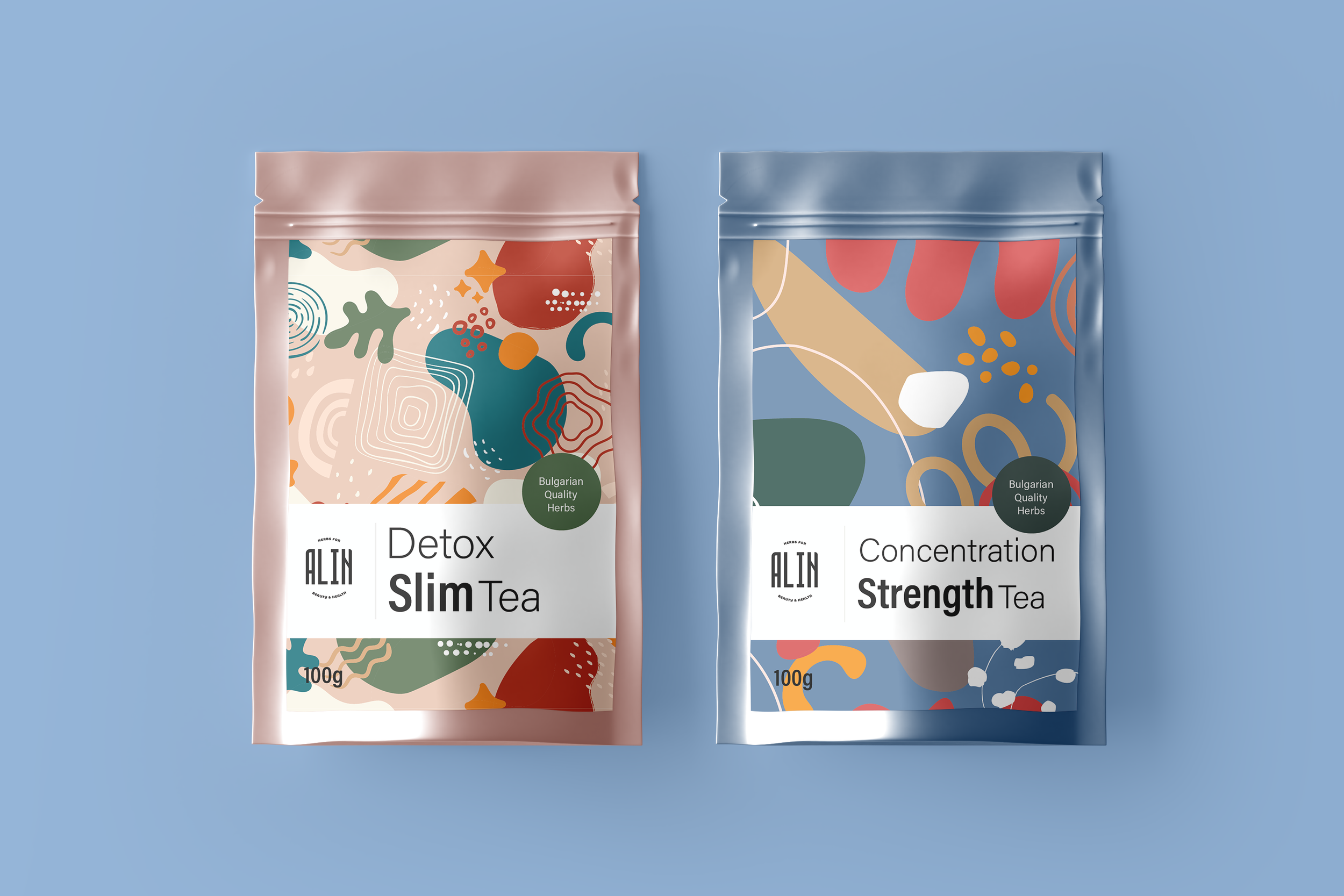 Two tea packages on a blue background, one labeled "Detox Slim Tea" with a pink pouch and abstract design, the other labeled "Concentration Strength Tea" with a blue pouch and abstract design. Both feature "Bulgarian Quality Herbs" and a "100g" label.