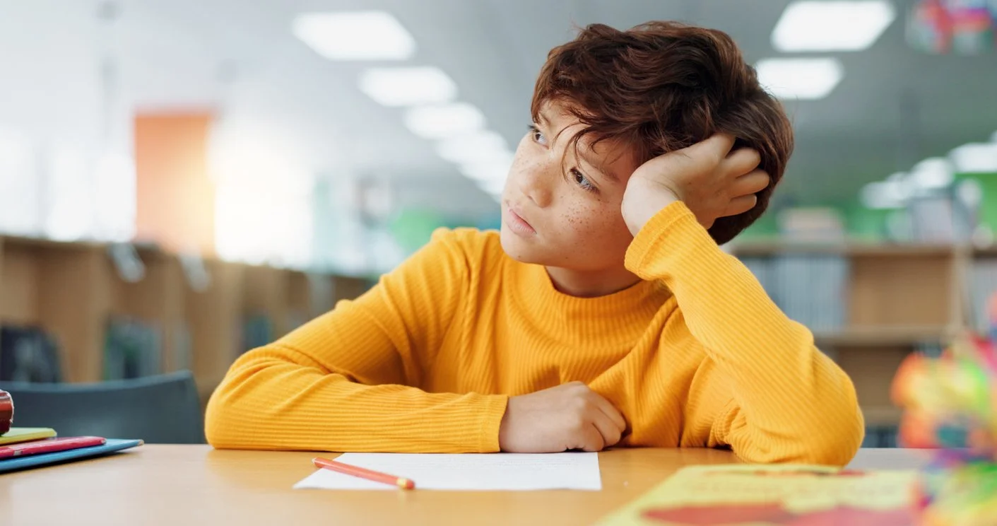 student in a classsroom unable to pay attention or complete work