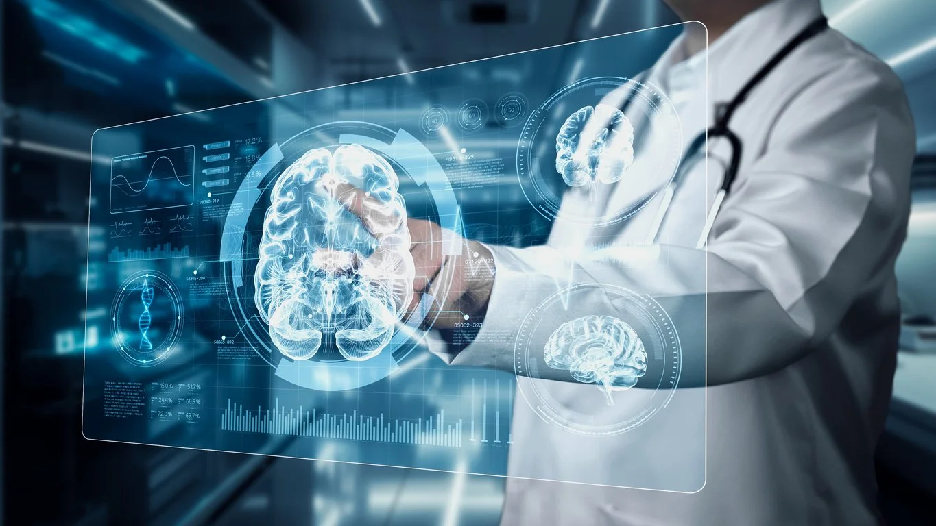 Close up of a medical professional pointing and looking at hologram of human brain