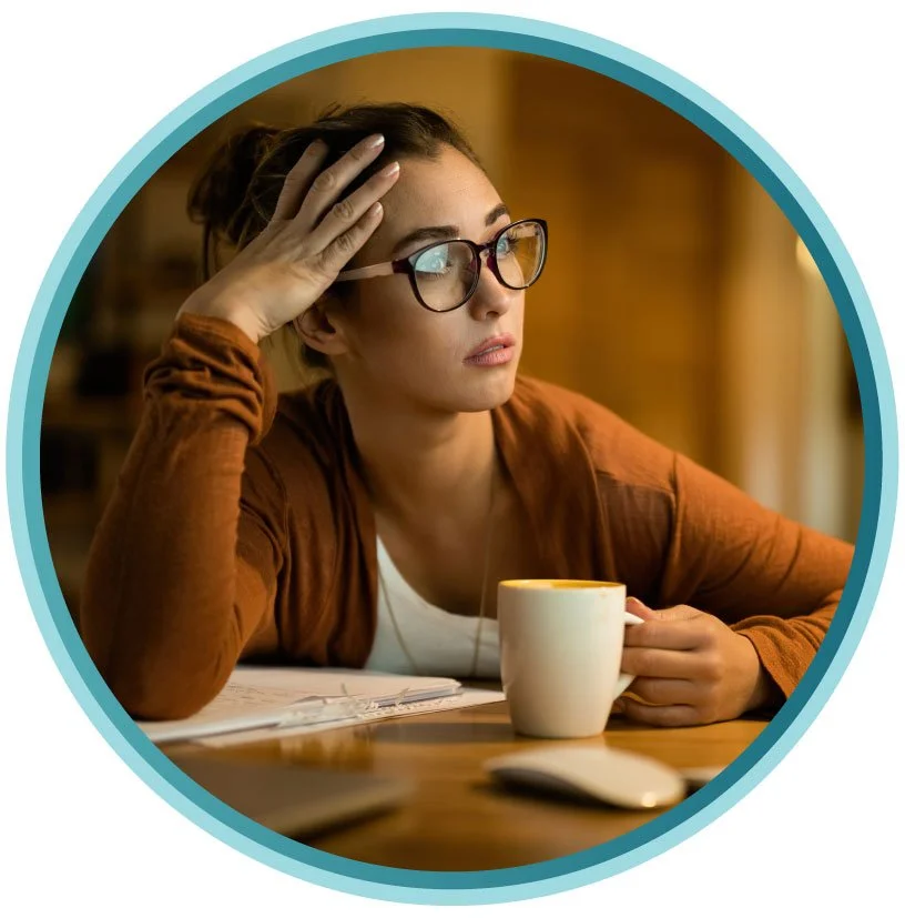 woman at table appears worried