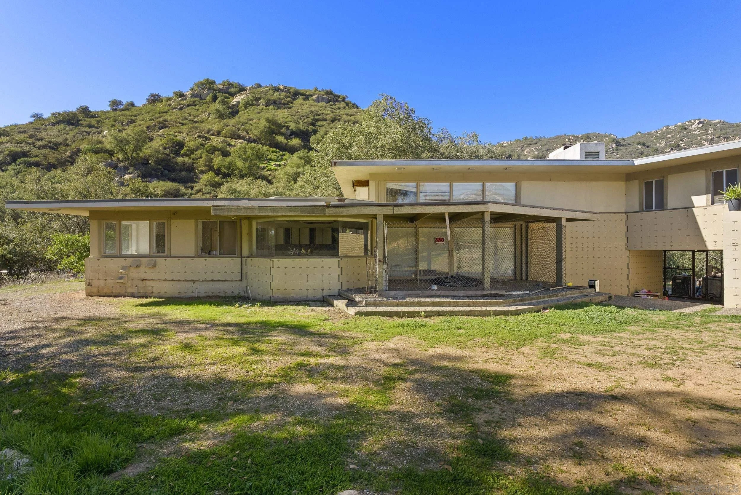 A true diamond in the rough by John Lloyd Wright in Valley Center.  An extraordinary opportunity with architectural pedigree and endless potential.