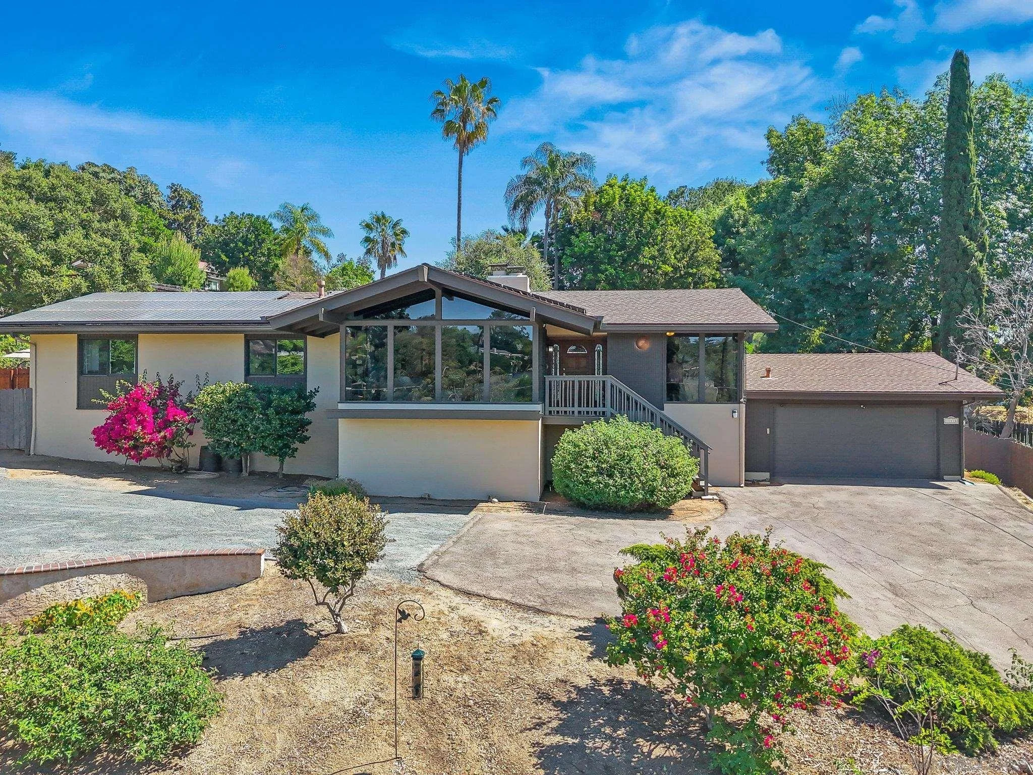 Mid Century Modern home in Mt. Helix featuring a pool, vaulted ceilings, and classic architectural style. A must see!
