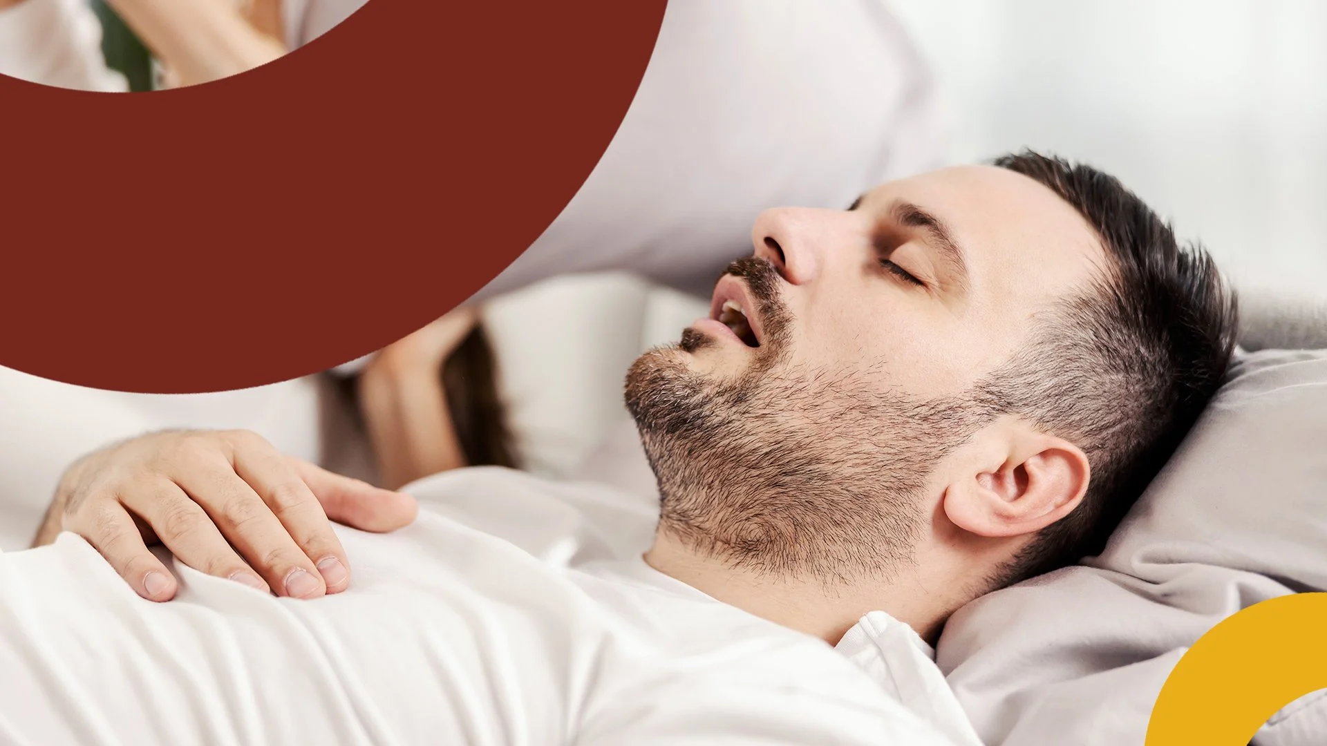 Man sleeping on a bed with one hand on his chest, surrounded by abstract shapes.