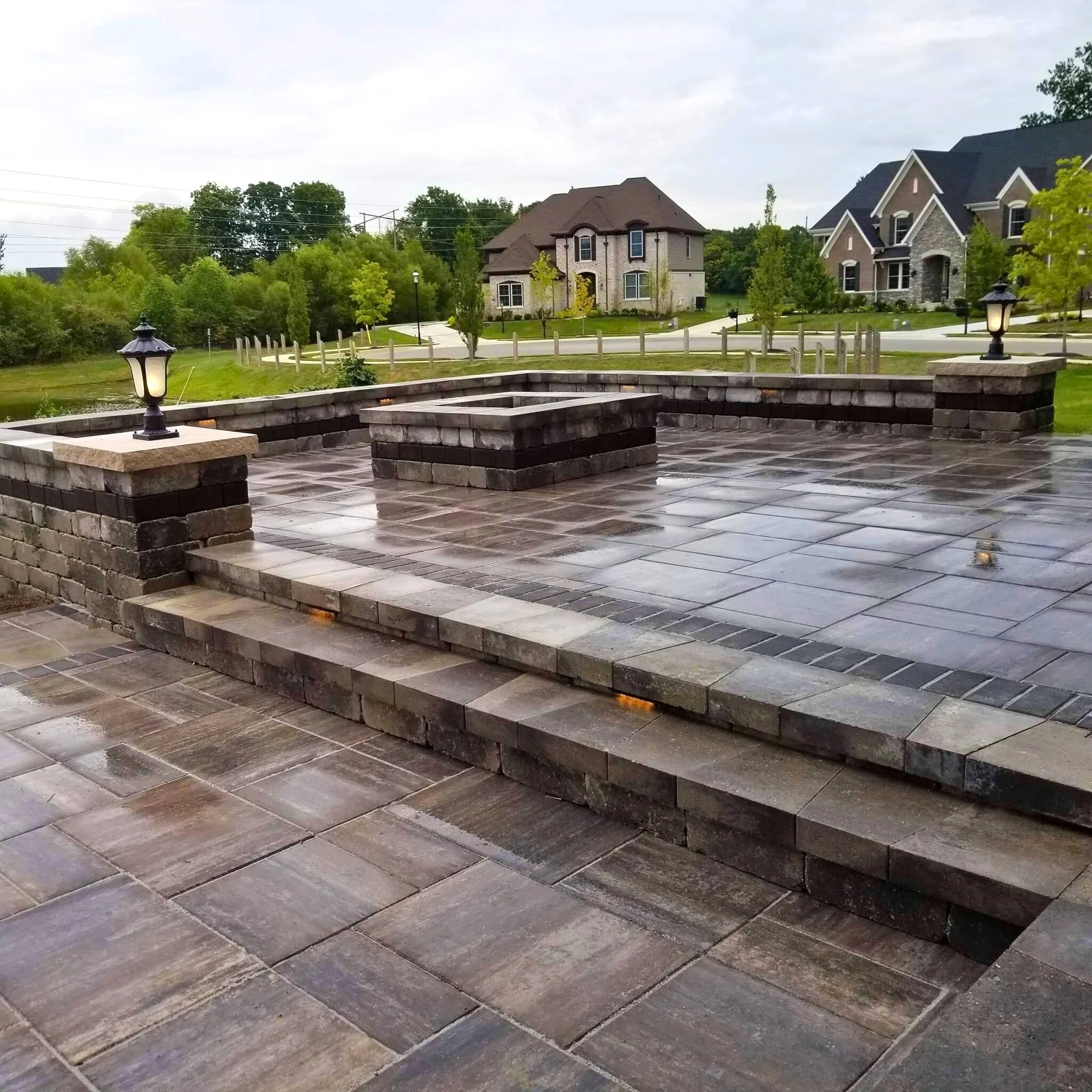 Grand Discover Timeless Two Tier Patio with Firepit and Retaining Wall.jpg