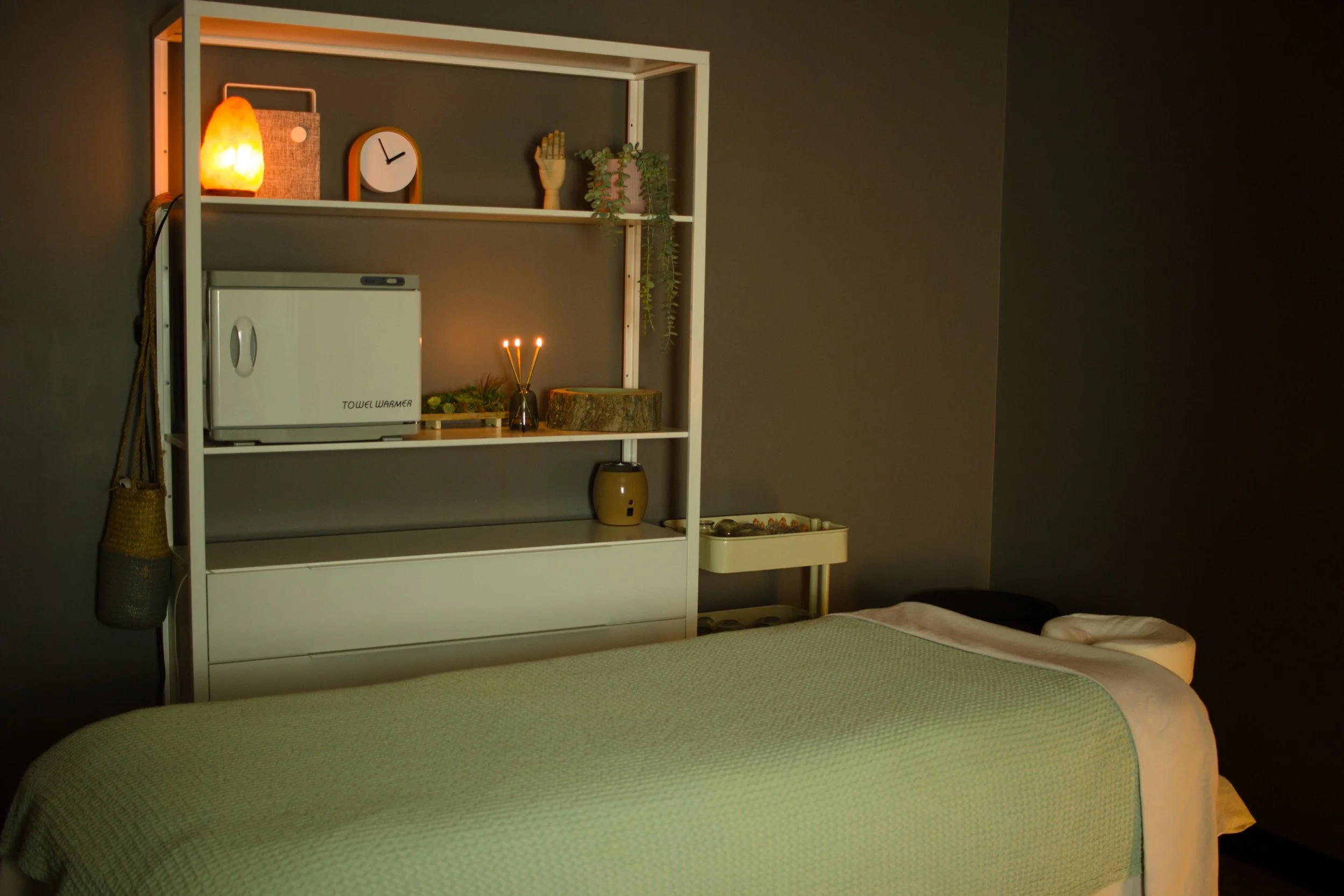 Massage table in a dimly lit comforting massage room