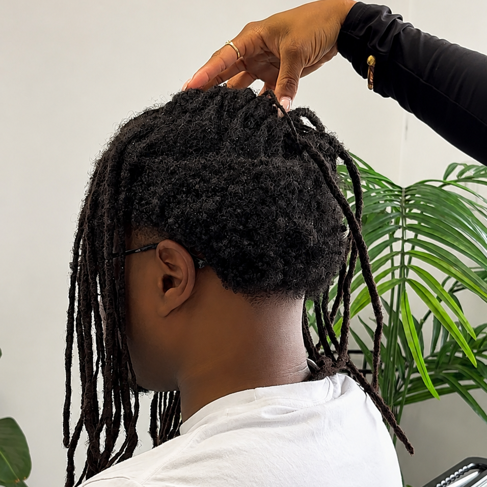 Client wants a full head of locs instead of a high top.