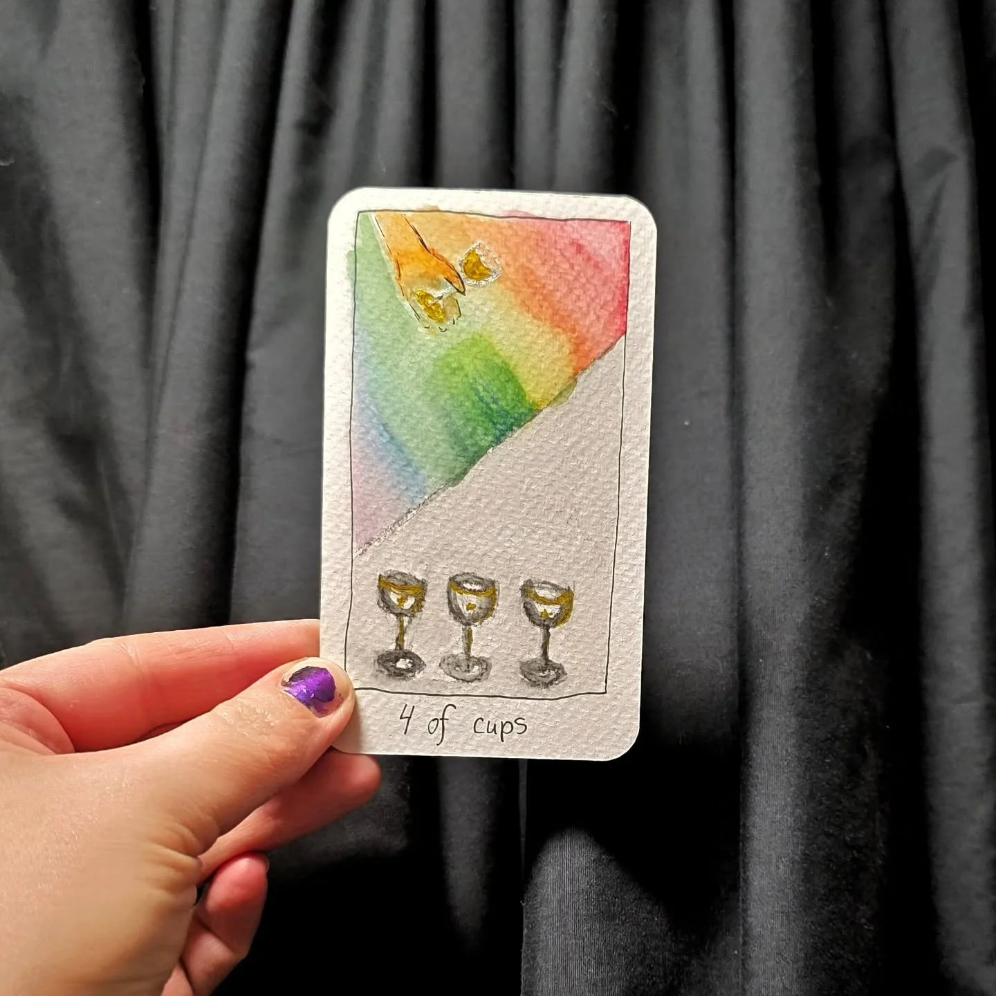 The 4 of cups - i changed my mind in how I wanted to depict the hand and the cup at the top half way though, so now its rather smudgy. But the meaning remains. You've got 3 cups, they are nice. But if you look just beyond and take notice of whats aro