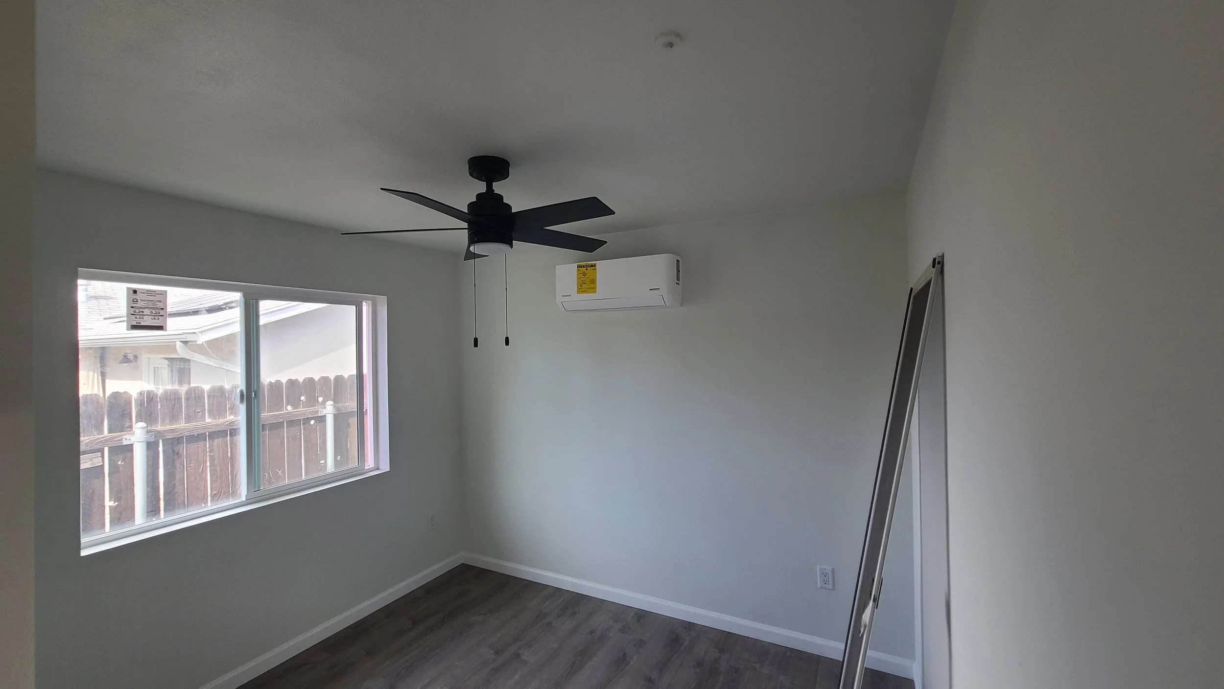 ADU Bedroom with ceiling fan, efficient mini split, along with a title 24 compliant window