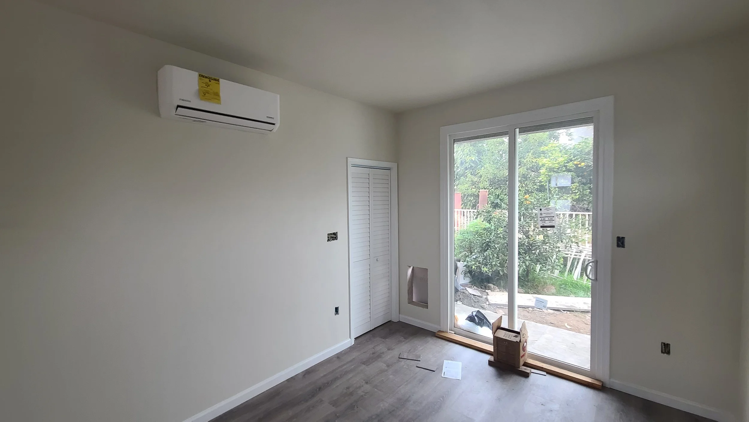 ADU Kitchen with large sliding door, highly efficient mini split