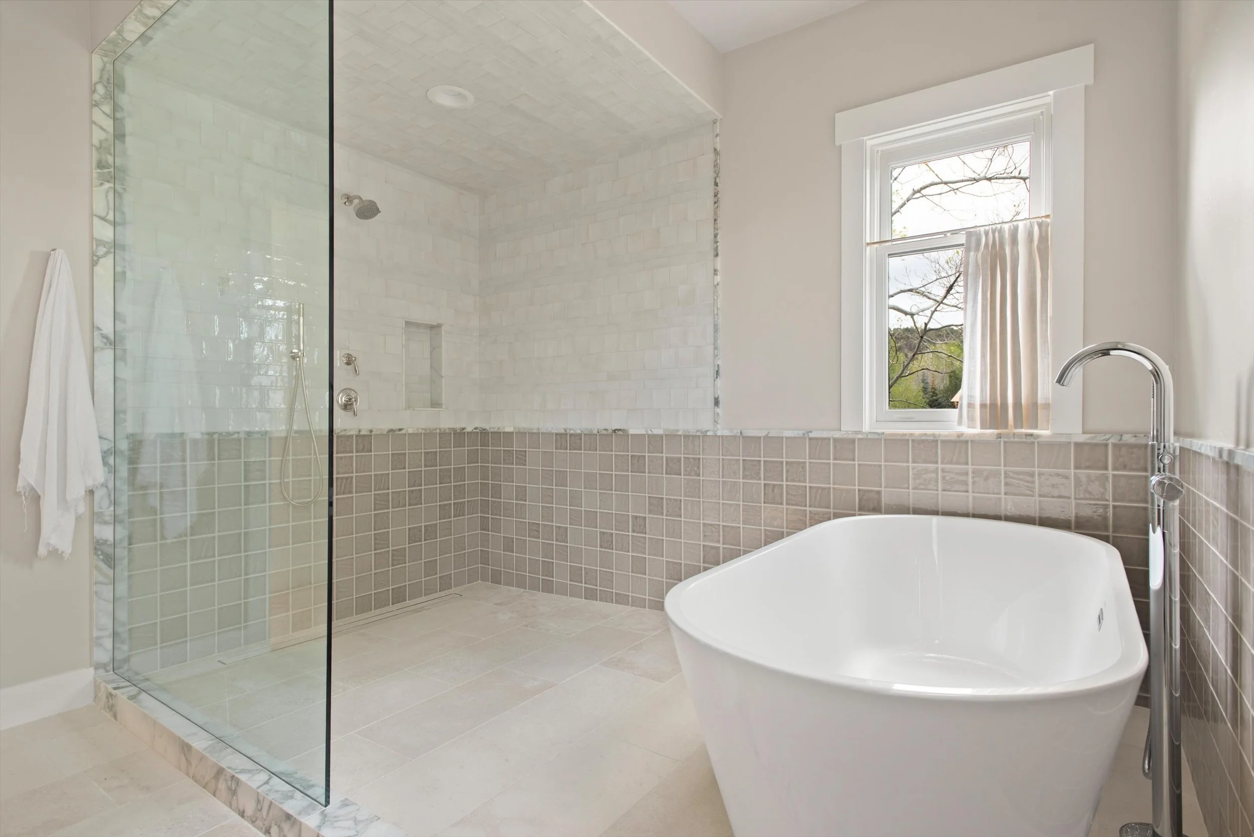 A complete transformation of a dated golf course residence, this renovation brought new life to the home through timeless design and exceptional craftsmanship. Highlights include a fully remodeled kitchen, five renovated bathrooms, custom-finished wa