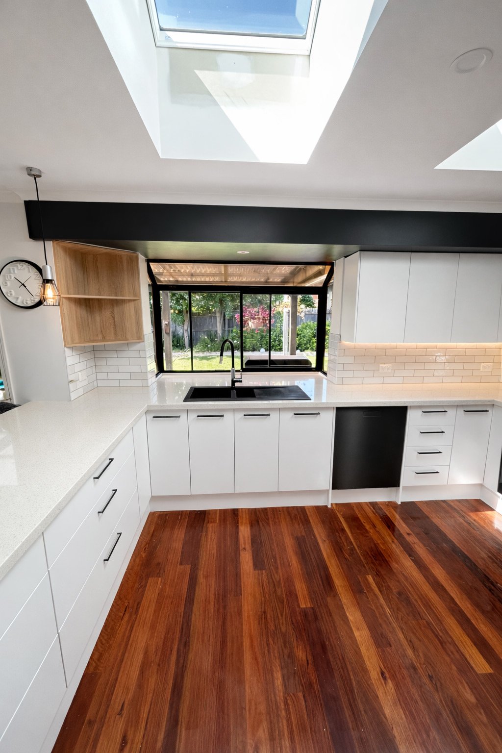 Modern kitchen renovation Wantirna with white cabinetry and stone benchtops by Apex.
