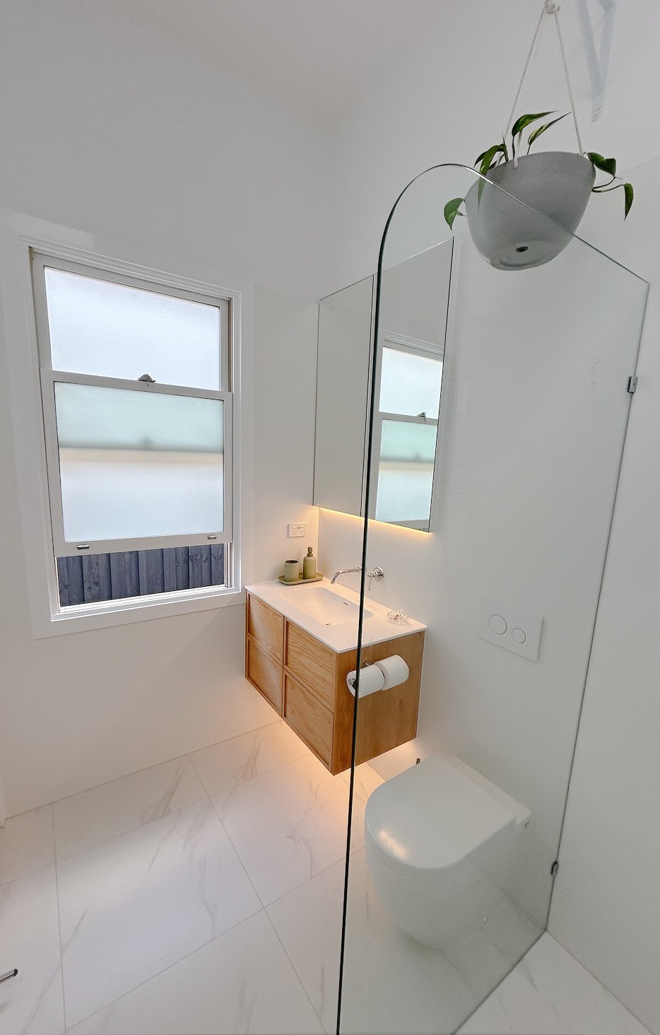 Luxury bathroom makeover with frameless shower and designer vanity Melbourne.