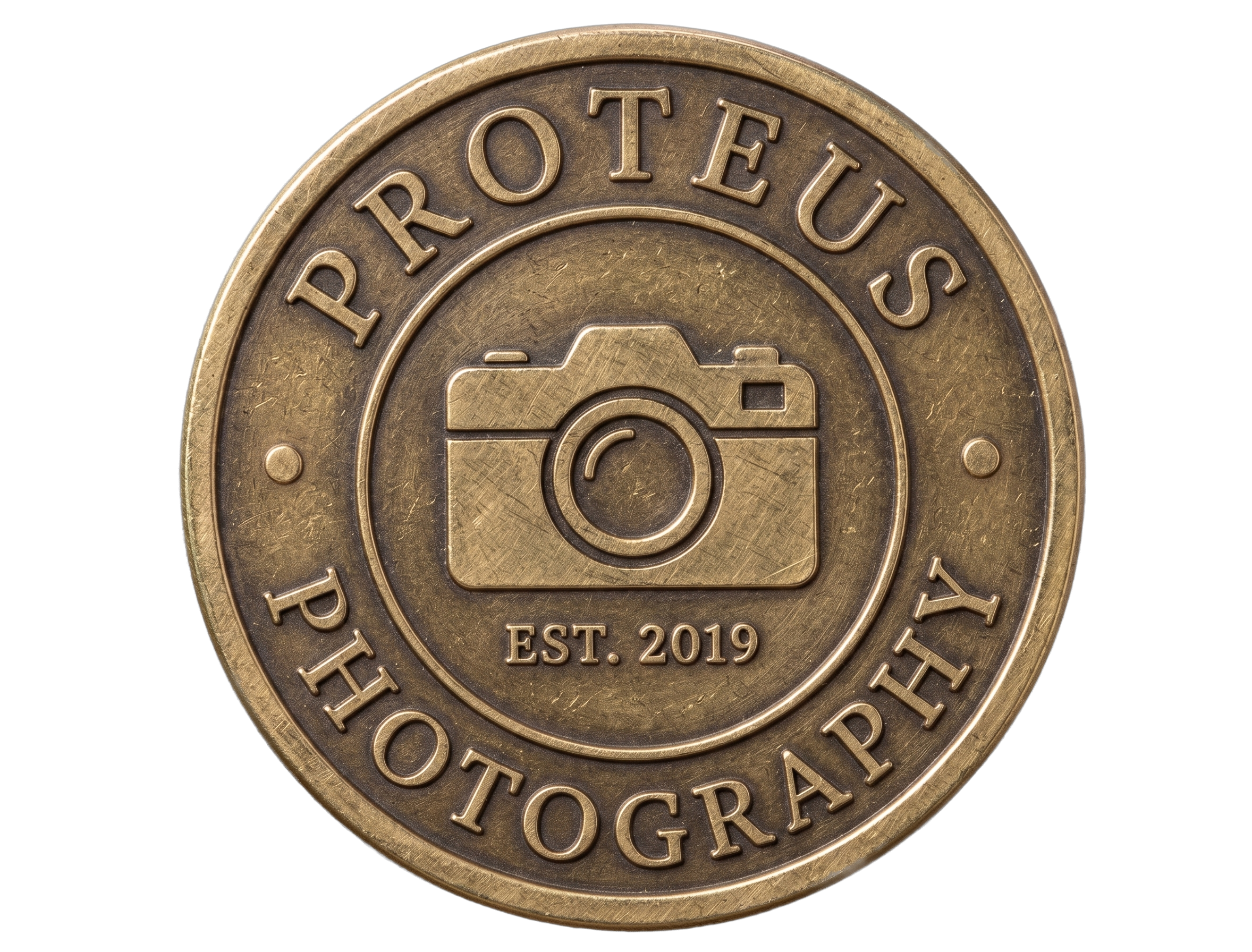 Close-up of a bronze-colored coin with the words 'PROPERTY OF THE OGA' and 'EST. 2019' inscribed on it, featuring a camera icon in the center.