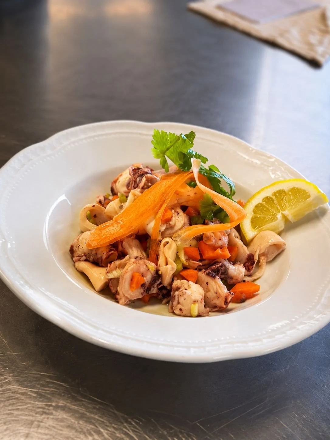 Fresh seafood pasta with vegetables and lemon at Cipressino