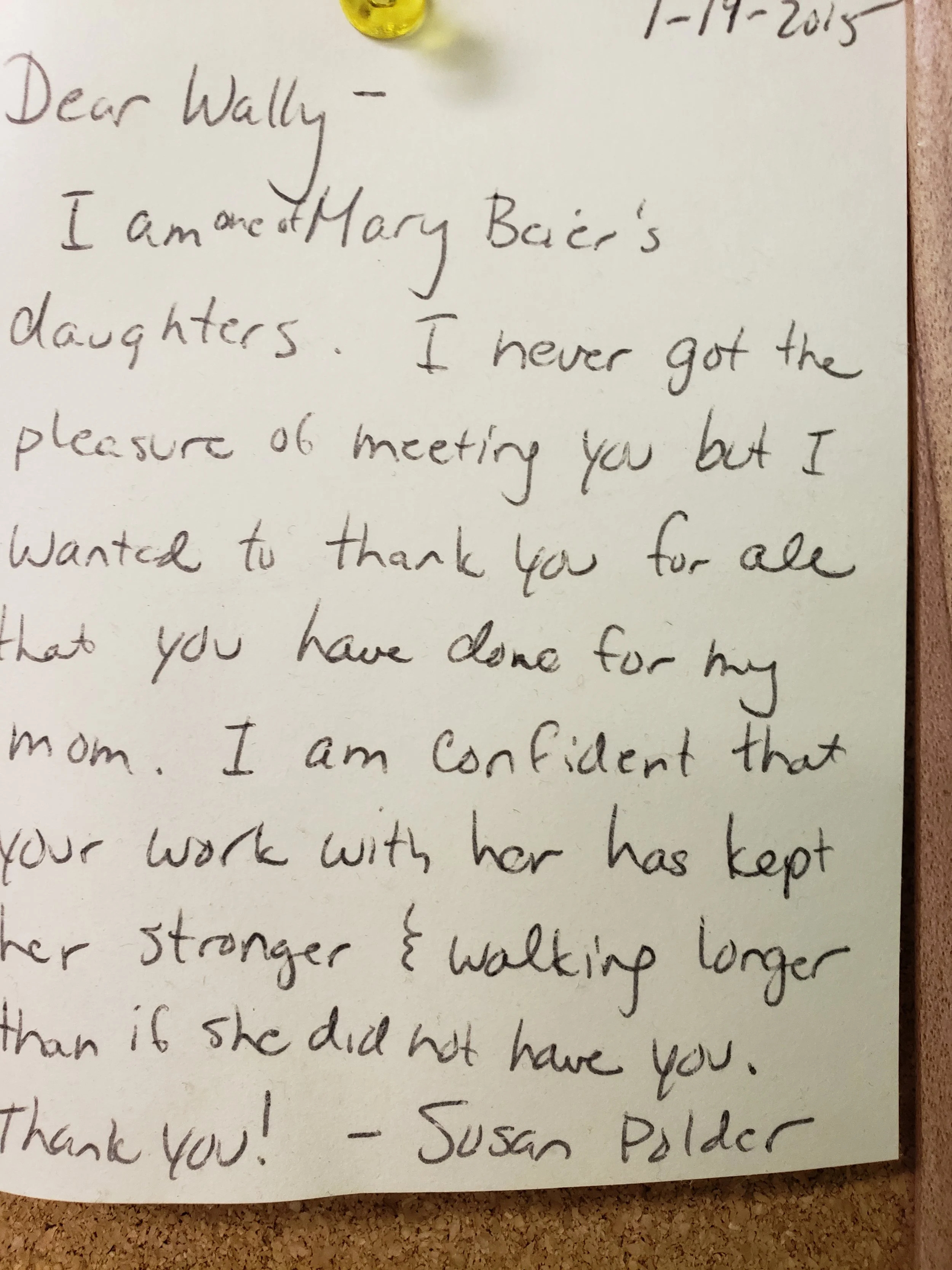 A handwritten letter dated 1-19-2015, addressed to Wally, expressing appreciation for her work with Susan Paider. The note is pinned to a corkboard with a yellow pushpin.
