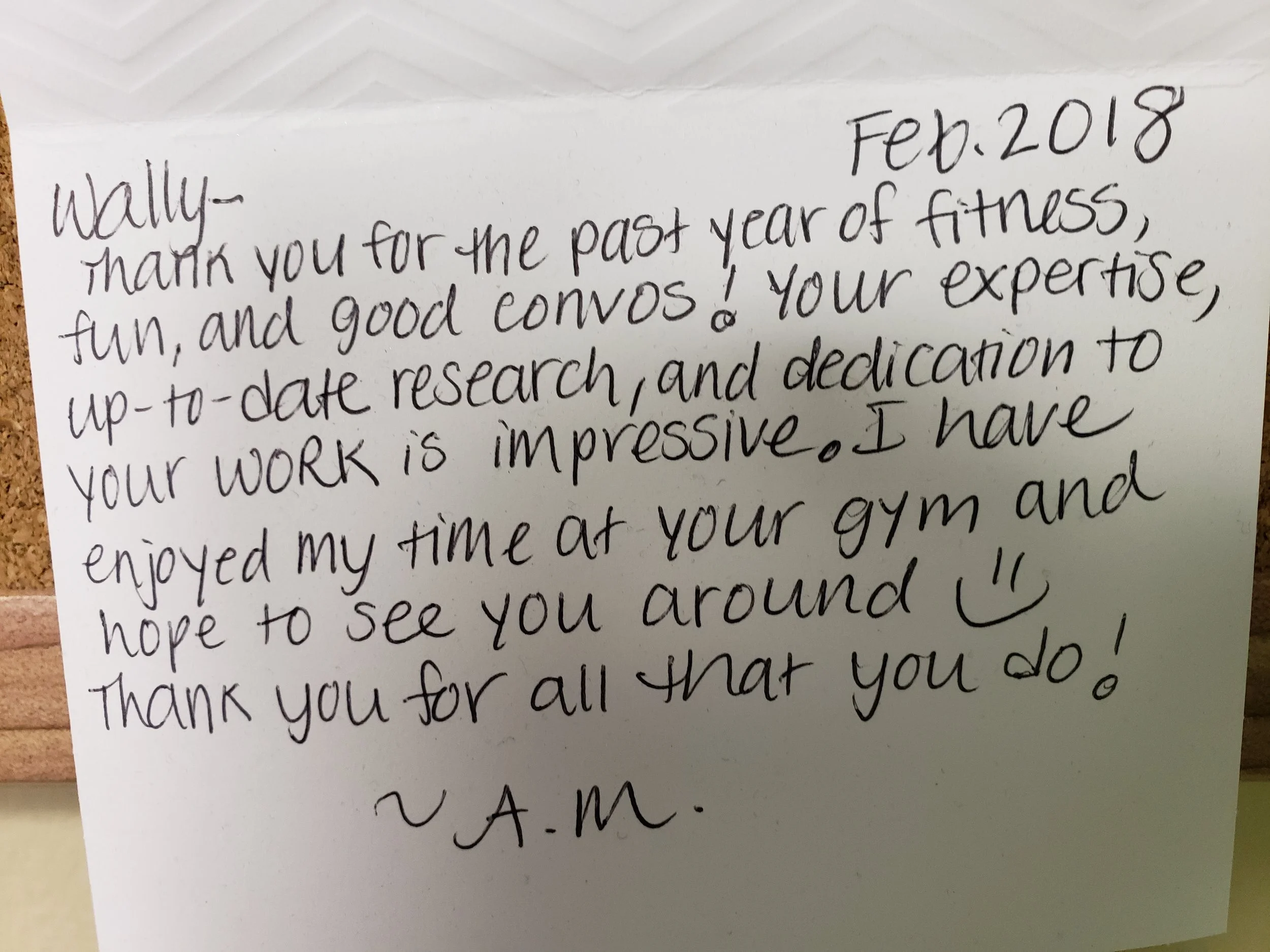 A handwritten thank-you note on white paper addressed to Wally, dated February 2018. It expresses gratitude for a fun and rewarding year of fitness, research, and work, with appreciation for being at the gym and anticipation of seeing Wally around.